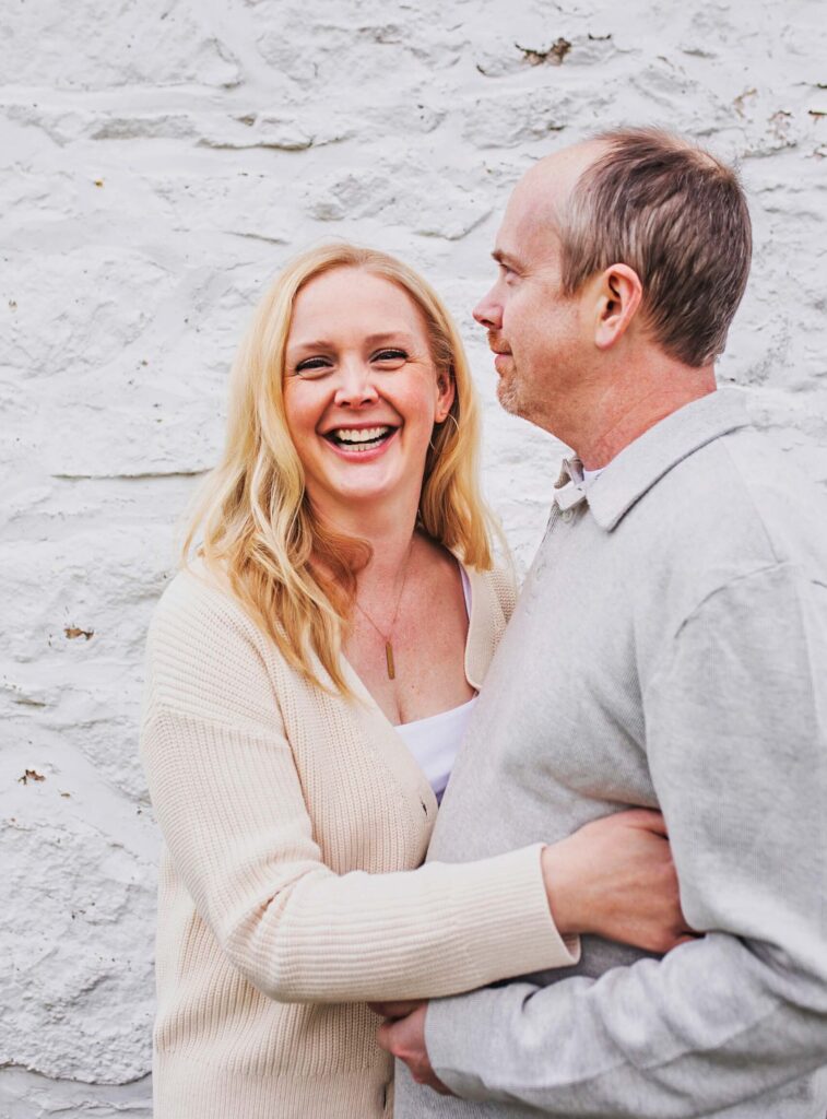 Couple smiling together outdoors.
